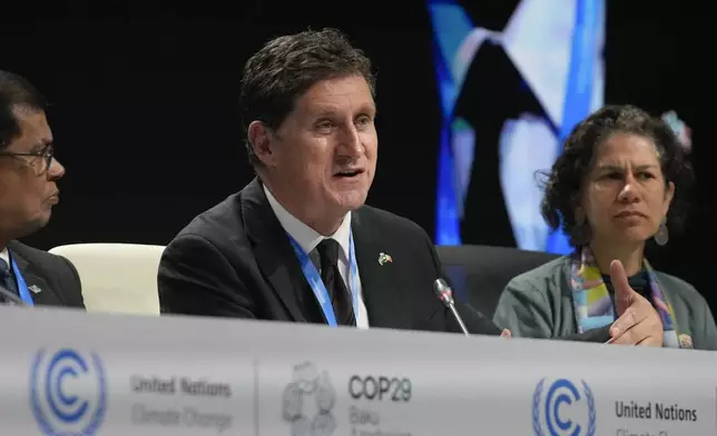 Eamon Ryan, Ireland climate minister, speaks at a session with the Marshall Islands High Ambition Coalition at the COP29 U.N. Climate Summit, Wednesday, Nov. 13, 2024, in Baku, Azerbaijan. (AP Photo/Rafiq Maqbool)