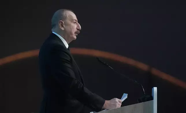 Ilham Aliyev, Azerbaijan president, speaks during a plenary session at the COP29 U.N. Climate Summit, Tuesday, Nov. 12, 2024, in Baku, Azerbaijan. (AP Photo/Rafiq Maqbool)