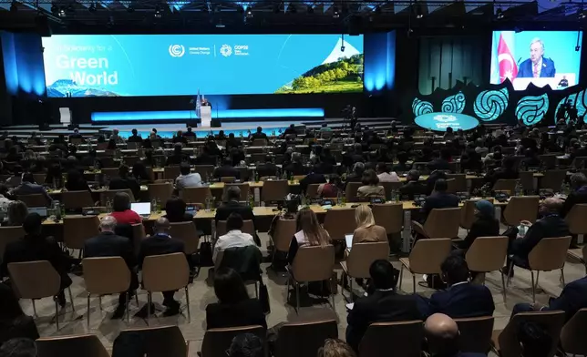 Antonio Guterres, United Nations secretary-general, speaks during a plenary session at the COP29 U.N. Climate Summit, Tuesday, Nov. 12, 2024, in Baku, Azerbaijan. (AP Photo/Rafiq Maqbool)