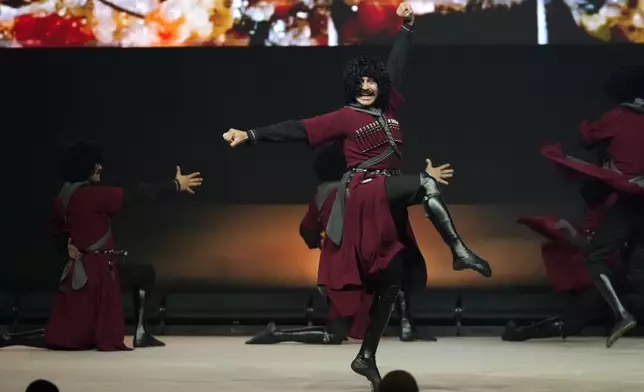 Dancers perform at the COP29 U.N. Climate Summit, Tuesday, Nov. 12, 2024, in Baku, Azerbaijan. (AP Photo/Rafiq Maqbool)