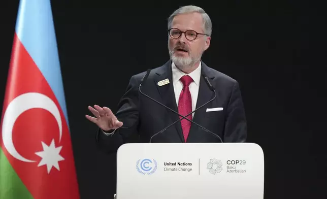 Czech Republic Prime Minister Petr Fiala speaks during a plenary session at the COP29 U.N. Climate Summit, Wednesday, Nov. 13, 2024, in Baku, Azerbaijan. (AP Photo/Sergei Grits)