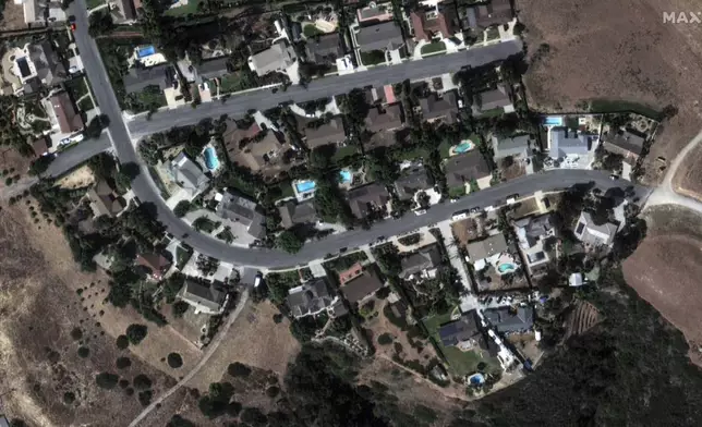 This satellite image released by Maxar Technologies shows houses in Camarillo, Calif., before being damaged by the fire, on Thursday Nov. 7, 2024. (Satellite image ©2024 Maxar Technologies via AP)