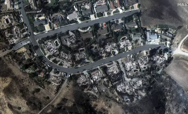 This satellite image released by Maxar Technologies shows fire-ravaged houses in Camarillo, Calif., on Thursday Nov. 7, 2024. (Satellite image ©2024 Maxar Technologies via AP)