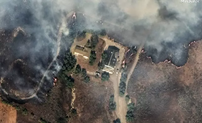 This satellite image released by Maxar Technologies shows the flames surrounding a house near Moorpark, Calif., on Thursday Nov. 7, 2024. (Satellite image ©2024 Maxar Technologies via AP)