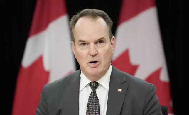 Canada Labour Minister Steven MacKinnon speaks with media during a news conference, Tuesday, Nov. 12, 2024, in Ottawa. (Adrian Wyld/The Canadian Press via AP)