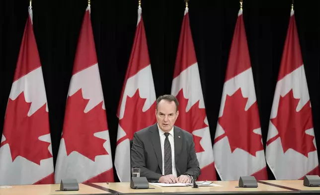 Canada Labour Minister Steven MacKinnon speaks with media during a news conference, Tuesday, Nov. 12, 2024, in Ottawa. (Adrian Wyld/The Canadian Press via AP)