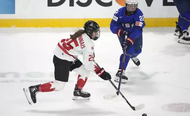 Canada defenseman Jaime Bourbonnais (25) skates up the ice past United States forward Tessa Janecke (22) during the first period of a women's Rivalry Series hockey game in San Jose, Calif., Wednesday, Nov. 6, 2024. (AP Photo/Tony Avelar)