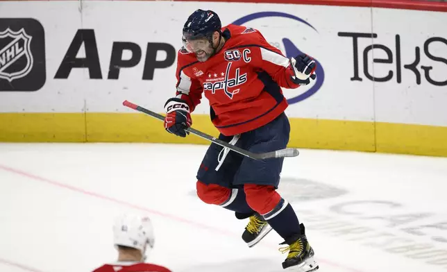 Washington Capitals left wing Alex Ovechkin (8) celebrates his goal during the third period of an NHL hockey game against the Montreal Canadiens, Thursday, Oct. 31, 2024, in Washington. The Capitals won 6-3. (AP Photo/Nick Wass)