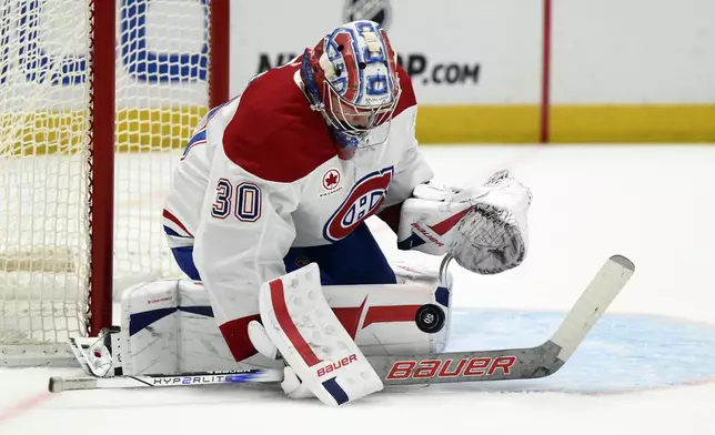 Montreal Canadiens goaltender Cayden Primeau (30) stops the puck during the first period of an NHL hockey game against the Washington Capitals, Thursday, Oct. 31, 2024, in Washington. (AP Photo/Nick Wass)