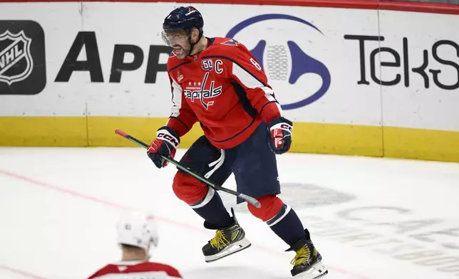 Washington Capitals left wing Alex Ovechkin (8) celebrates his goal during the third period of an NHL hockey game against the Montreal Canadiens, Thursday, Oct. 31, 2024, in Washington. The Capitals won 6-3. (AP Photo/Nick Wass)