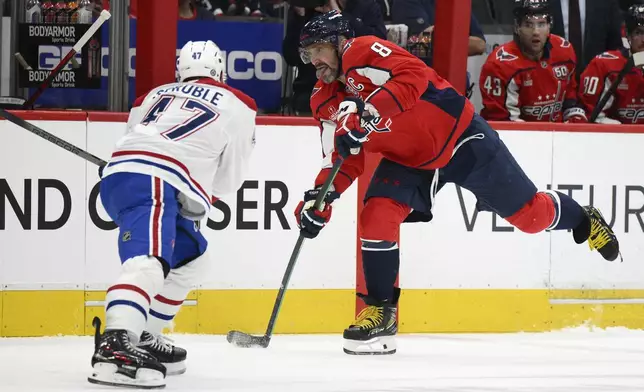 Washington Capitals left wing Alex Ovechkin (8) skates with the puck against Montreal Canadiens defenseman Jayden Struble (47) during the first period of an NHL hockey game, Thursday, Oct. 31, 2024, in Washington. (AP Photo/Nick Wass)