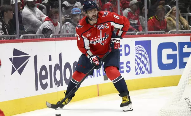 Washington Capitals left wing Alex Ovechkin (8) skates with the puck during the first period of an NHL hockey game against the Montreal Canadiens, Thursday, Oct. 31, 2024, in Washington. (AP Photo/Nick Wass)