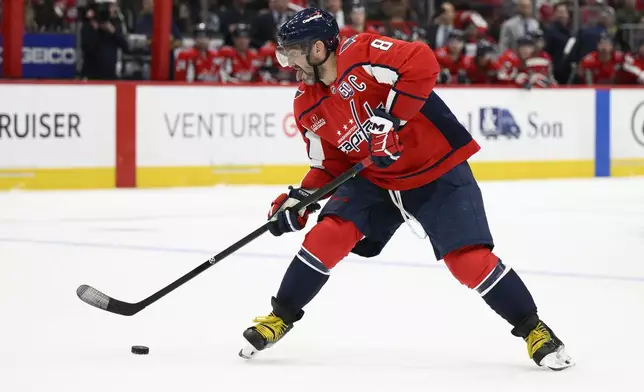 Washington Capitals left wing Alex Ovechkin (8) skates with the puck during the first period of an NHL hockey game against the Montreal Canadiens, Thursday, Oct. 31, 2024, in Washington. (AP Photo/Nick Wass)