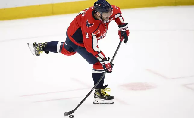 Washington Capitals left wing Alex Ovechkin (8) shoots the puck during the third period of an NHL hockey game against the Montreal Canadiens, Thursday, Oct. 31, 2024, in Washington. The Capitals won 6-3. (AP Photo/Nick Wass)