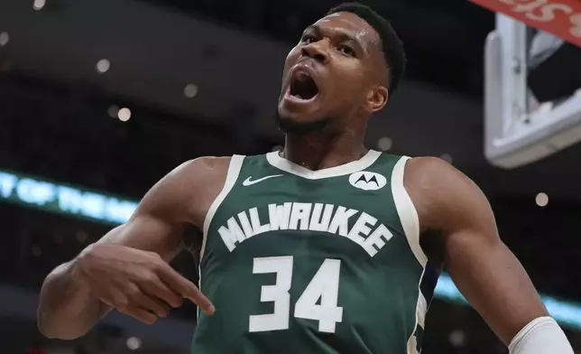 Milwaukee Bucks' Giannis Antetokounmpo reacts after making a shot and being fouled during the first half of an NBA basketball game Saturday, Nov. 2, 2024, in Milwaukee. (AP Photo/Morry Gash)