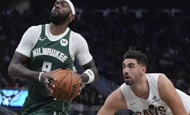 Milwaukee Bucks' Bobby Portis gets past Cleveland Cavaliers' Georges Niang during the first half of an NBA basketball game Saturday, Nov. 2, 2024, in Milwaukee. (AP Photo/Morry Gash)