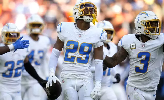 Los Angeles Chargers cornerback Tarheeb Still (29) celebrates after intercepting a pass against the Cleveland Browns in the second half of an NFL football game Sunday, Nov. 3, 2024, in Cleveland. (AP Photo/Sue Ogrocki)