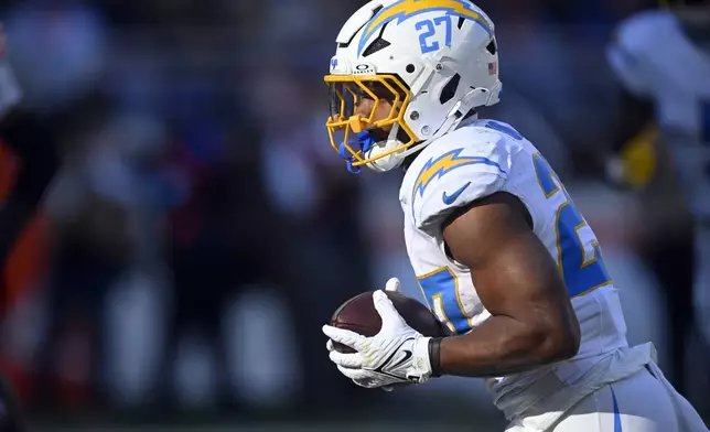 Los Angeles Chargers running back J.K. Dobbins runs 16 yards for a touchdown against the Cleveland Browns in the first half of an NFL football game Sunday, Nov. 3, 2024, in Cleveland. (AP Photo/David Richard)