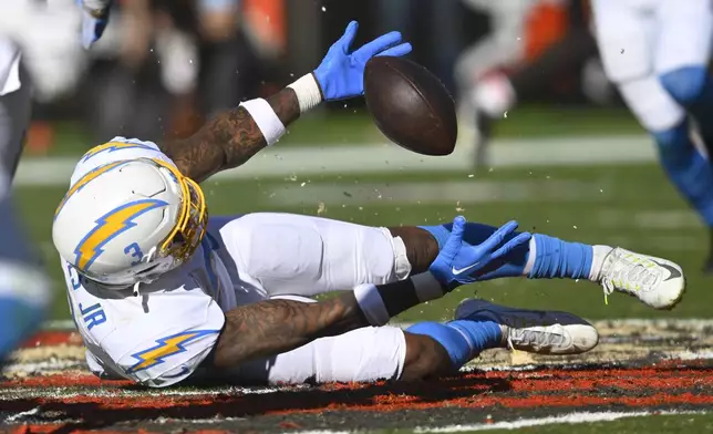 Los Angeles Chargers safety Derwin James Jr. reaches for the ball but can't make the interception against the Cleveland Browns in the first half of an NFL football game Sunday, Nov. 3, 2024, in Cleveland. (AP Photo/David Richard)