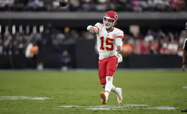 Kansas City Chiefs quarterback Patrick Mahomes (15) throws during the second half of an NFL football game against the Las Vegas Raiders Sunday, Oct. 27, 2024, in Las Vegas. (AP Photo/John Locher)