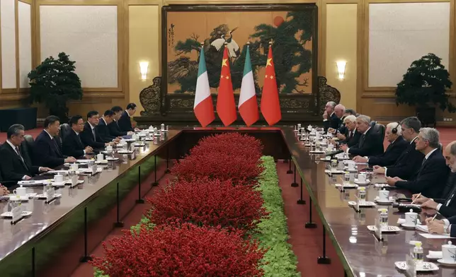 Chinese President Xi Jinping, second from left, attends a meeting with Italian President Sergio Mattarella, fourth from right, at the Great Hall of the People in Beijing, Friday, Nov. 8, 2024. (Florence Lo/Pool Photo via AP)