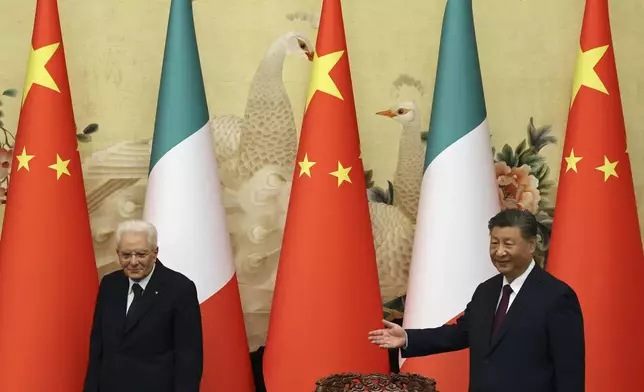 Chinese President Xi Jinping, right, and Italian President Sergio Mattarella arrive for a signing ceremony at the Great Hall of the People in Beijing, Friday, Nov. 8, 2024. (Florence Lo/Pool Photo via AP)