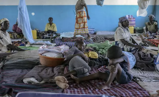 FILE - Residents take refugee at Ombaka Primary School after fleeing floodwaters that wreaked havoc in Ombaka Village, Kisumu, Kenya, April 17, 2024. (AP Photo/Brian Ongoro)