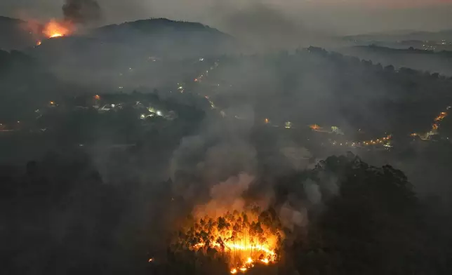 FILE - A wildfire consumes a rural area in Varzea Paulista, Sao Paulo state, Brazil, Sept. 13, 2024. (AP Photo/Andre Penner, File)