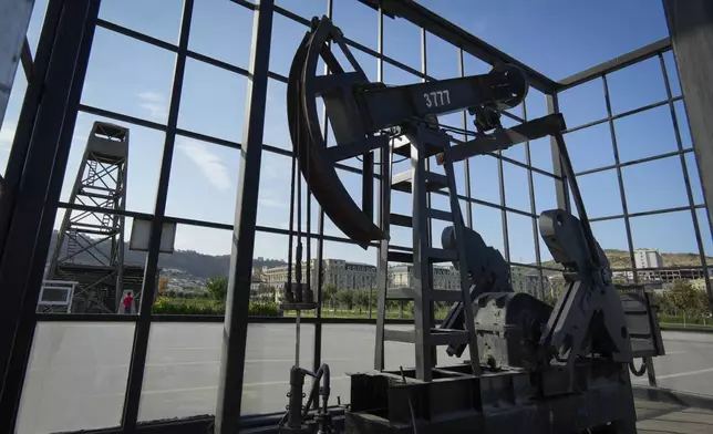 A pumpjack operates in Baku, Azerbaijan, Monday, Sept. 16, 2024. (AP Photo/Sergei Grits)