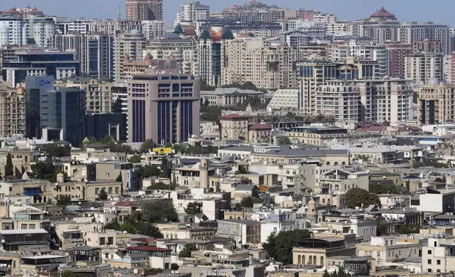 Buildings are visible in Baku, Azerbaijan, Monday, Sept. 16, 2024. (AP Photo/Sergei Grits)