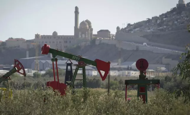 A pumpjack operates in Baku, Azerbaijan, Monday, Sept. 16, 2024. (AP Photo/Sergei Grits)