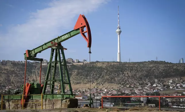 A pumpjack operates at a drilling site in Baku, Azerbaijan, Monday, Sept. 16, 2024. (AP Photo/Sergei Grits)