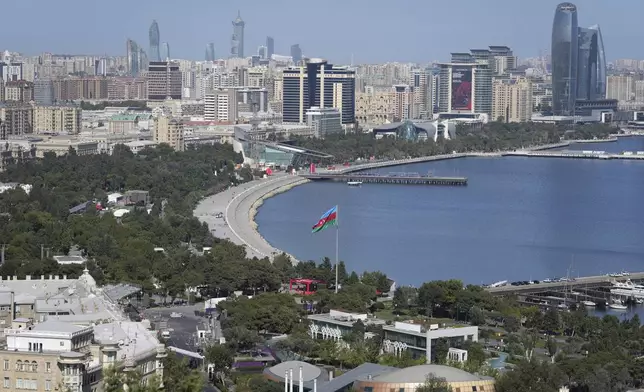 An Azerbaijan flag is displayed near Baku Bay, in Baku, Azerbaijan, Monday, Sept. 16, 2024. (AP Photo/Sergei Grits)