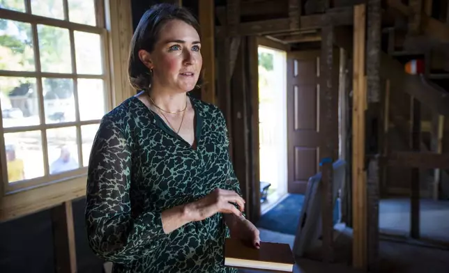 Katie McKinney, is the Margaret Beck Pritchard Associate curator of Maps and Prints for the Colonial Williamsburg Foundation on Wednesday, Oct 30, 2024 in Williamsburg, Va. (AP Photo/John C. Clark)