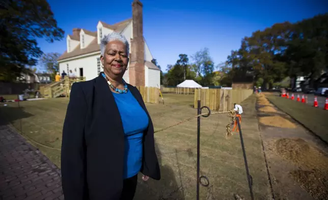 Janice Canaday, Colonial Williamsburg Foundations African American community engagement manager, stands outside near the Williamsburg Bray School on Wednesday, Oct 30, 2024 in Williamsburg, Va. (AP Photo/John C. Clark)