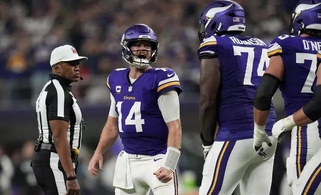 Minnesota Vikings quarterback Sam Darnold (14) celebrates after throwing a touchdown pass during the second half of an NFL football game against the Indianapolis Colts, Sunday, Nov. 3, 2024, in Minneapolis. (AP Photo/Abbie Parr)