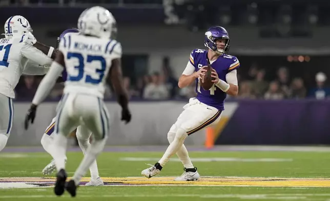 Minnesota Vikings quarterback Sam Darnold (14) looks to pass during the first half of an NFL football game against the Indianapolis Colts, Sunday, Nov. 3, 2024, in Minneapolis. (AP Photo/Abbie Parr)