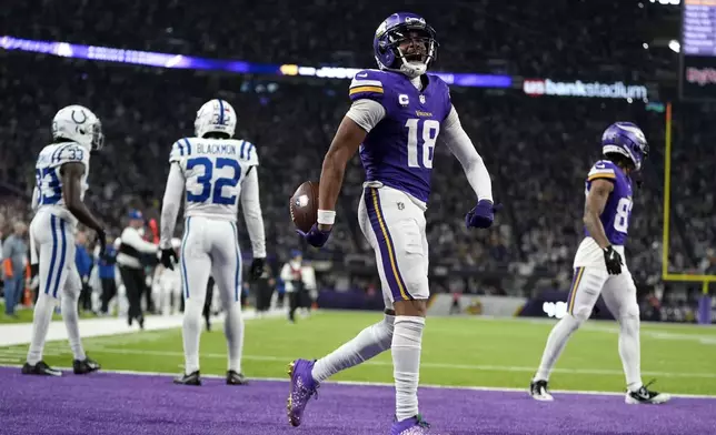 Minnesota Vikings wide receiver Justin Jefferson (18) celebrates after catching a pass for a first down during the second half of an NFL football game against the Indianapolis Colts, Sunday, Nov. 3, 2024, in Minneapolis. (AP Photo/Abbie Parr)