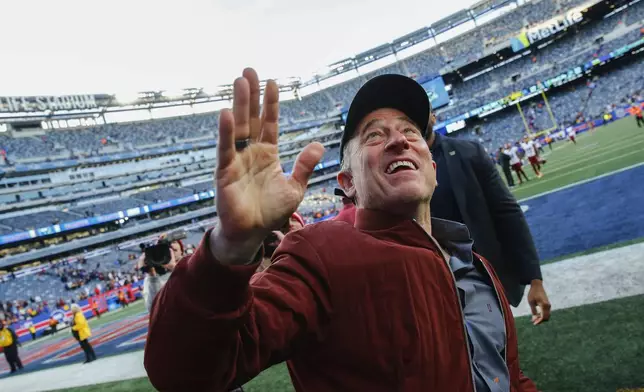 Washington Commanders owner Josh Harris walks off the field after an NFL football game against the New York Giants, Sunday, Nov. 3, 2024, in East Rutherford, N.J. (AP Photo/John Munson)