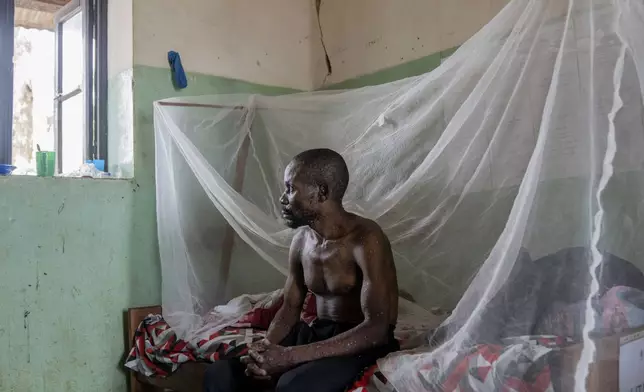 FILE - A man suffering from mpox poses for a photograph as he waits for treatment at the Kamituga General Hospital in South Kivu Congo, Sept. 4, 2024. (AP Photo/Moses Sawasawa, file )