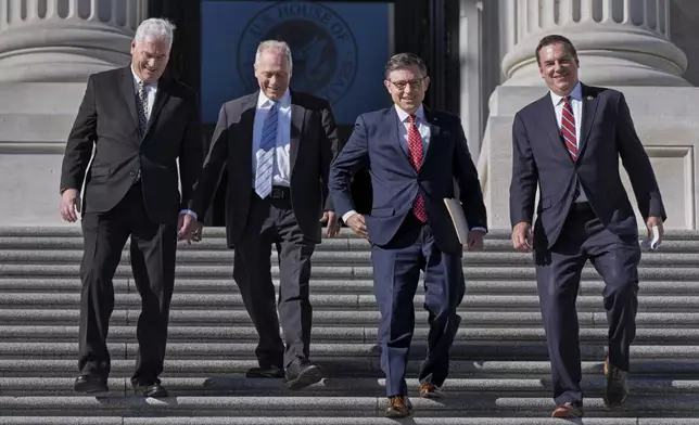 House Republican leaders, from left, Majority Whip Tom Emmer, R-Minn., Majority Leader Steve Scalise, R-La., Speaker of the House Mike Johnson, R-La., and Rep. Richard Hudson, R-N.C., chairman of the National Republican Congressional Committee, arrive to tout Republican wins and meet with reporters on the steps of the Capitol in Washington, Tuesday, Nov. 12, 2024. Congress returns to work this week to begin what is known as a lame-duck session — that period between Election Day and the end of the two-year congressional term. (AP Photo/J. Scott Applewhite)