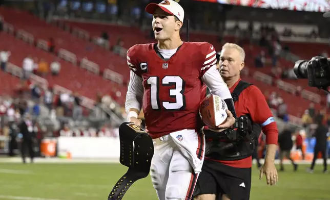 San Francisco 49ers quarterback Brock Purdy (13) jogs off the field after an NFL football game against the Dallas Cowboys in Santa Clara, Calif., Sunday, Oct. 27, 2024. (AP Photo/Eakin Howard)