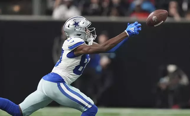 Dallas Cowboys wide receiver CeeDee Lamb tries in vain to catch a pass during the second half of an NFL football game against the Dallas Cowboys, Sunday, Nov. 3, 2024, in Atlanta. (AP Photo/ Brynn Anderson)