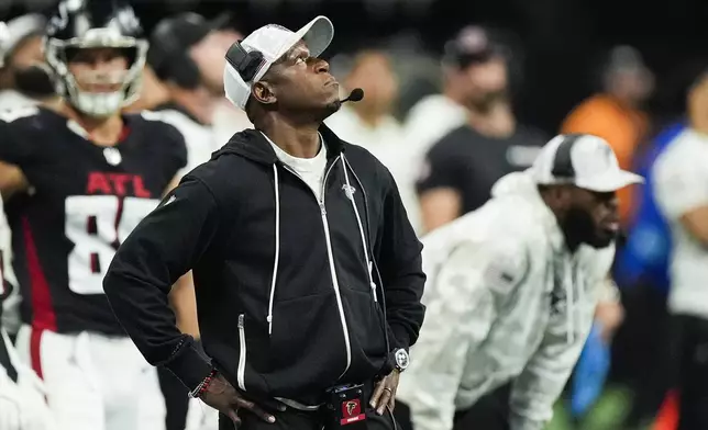 Atlanta Falcons head coach Raheem Morris looks up from the sideline during the first half of an NFL football game against the Dallas Cowboys, Sunday, Nov. 3, 2024, in Atlanta. (AP Photo/ John Bazemore)