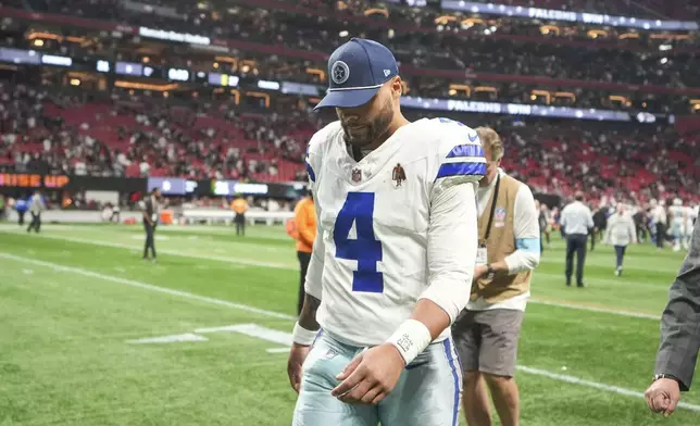 Dallas Cowboys quarterback Dak Prescott (4) walks off the field after an NFL football game against the Atlanta Falcons, Sunday, Nov. 3, 2024, in Atlanta. The Falcons won 27-21. (AP Photo/ Brynn Anderson)