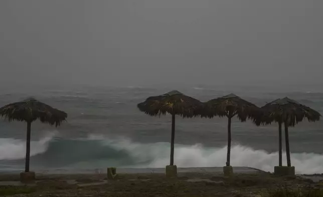 Waves break on the beach during the passing of Hurricane Rafael in Havana, Cuba, Wednesday, Nov. 6, 2024. (AP Photo/Ramon Espinosa)