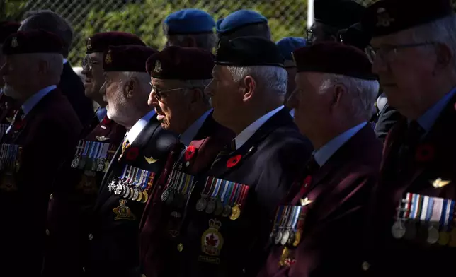 Canadian veterans stand commemorating the 60th anniversary of Canada's contribution to the UN Peacekeeping Force in Cyprus at Wolseley Barracks inside a UN-controlled buffer zone cleaving the capital Nicosia, Cyprus, on Monday, Nov. 11, 2024. (AP Photo/Petros Karadjias)