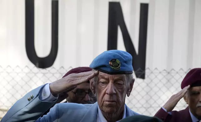 Canadian veteran Ronald Reginald Griffis salutes during a commemoration for the 60th anniversary of Canada's contribution to the UN Peacekeeping Force in Cyprus at Wolseley Barracks inside a UN-controlled buffer zone cleaving the capital Nicosia, Cyprus, on Monday, Nov. 11, 2024. (AP Photo/Petros Karadjias)