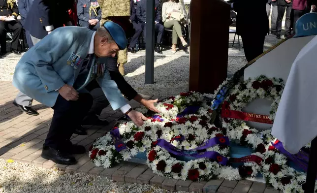 Canadian veteran Ronald Reginald Griffis lays a wreath at the unveiling of a plaque commemorating the 60th anniversary of Canada's contribution to the UN Peacekeeping Force in Cyprus at Wolseley Barracks inside a UN-controlled buffer zone cleaving the capital Nicosia, Cyprus, on Monday, Nov. 11, 2024. (AP Photo/Petros Karadjias)