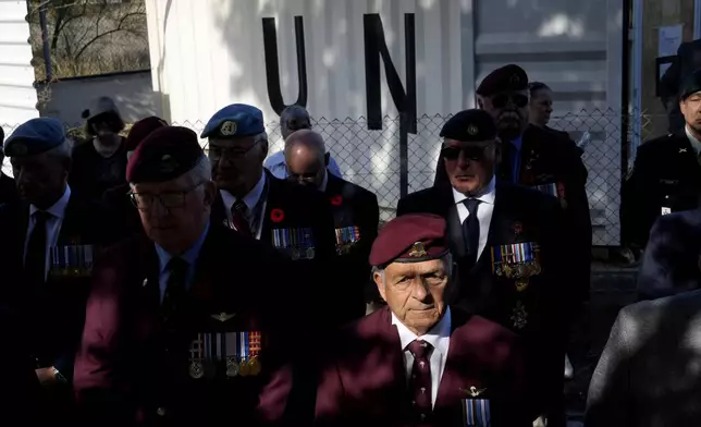 Canadian veterans stand commemorating the 60th anniversary of Canada's contribution to the UN Peacekeeping Force in Cyprus at Wolseley Barracks inside a UN-controlled buffer zone cleaving the capital Nicosia, Cyprus, on Monday, Nov. 11, 2024. (AP Photo/Petros Karadjias)